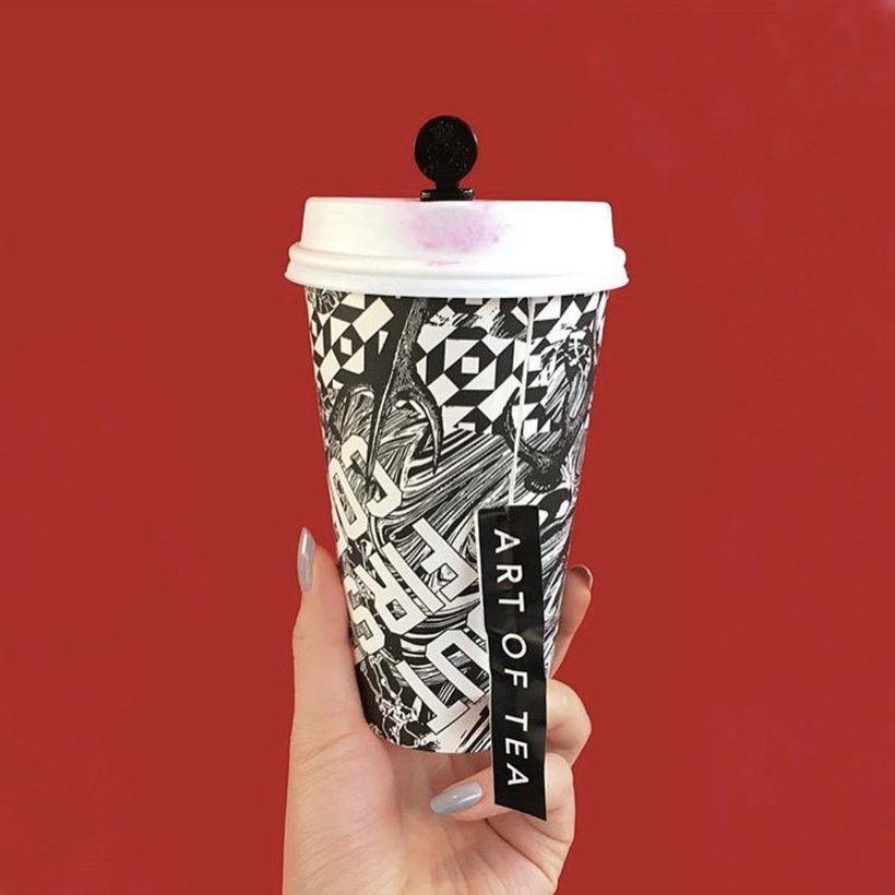 Art of Tea to-go cup with patterned sleeve